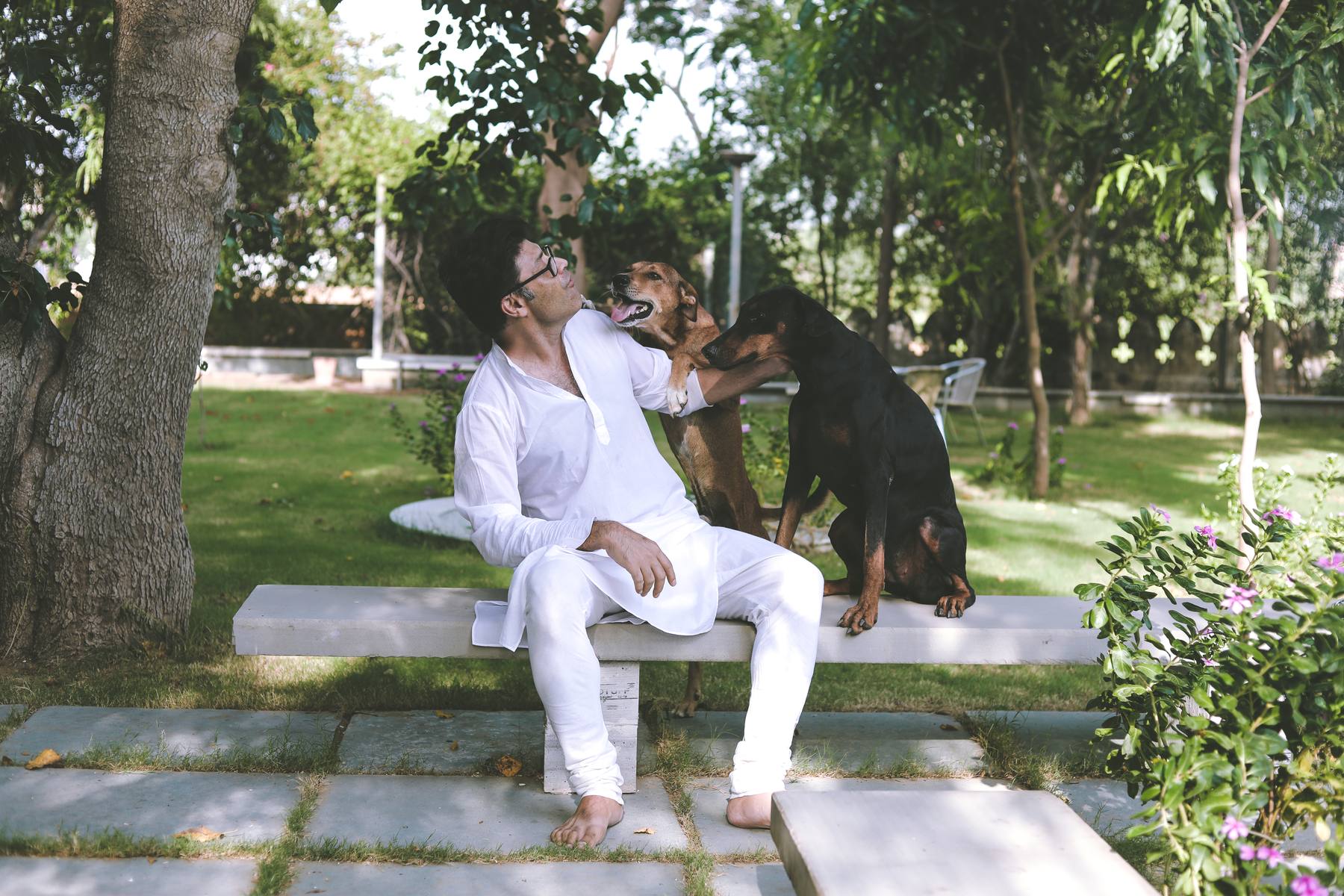 Udai with dogs on the farm