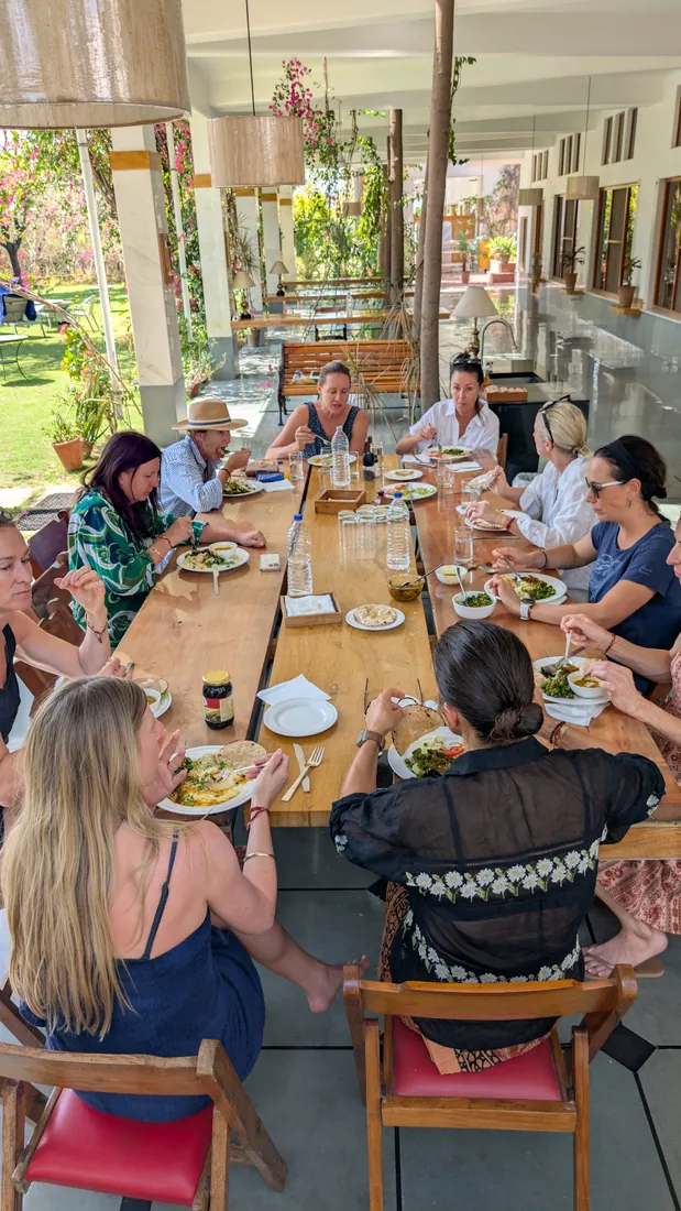 Australian yoga group enjoying lunch at the communal dining table