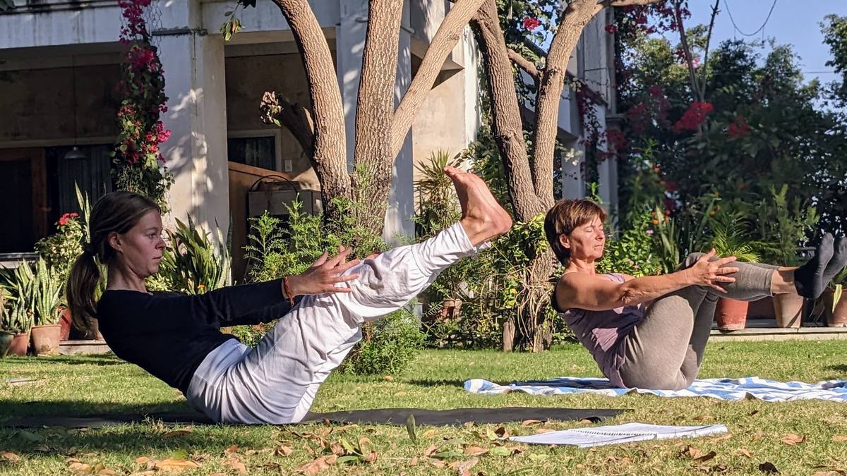 Two guests in bow pose