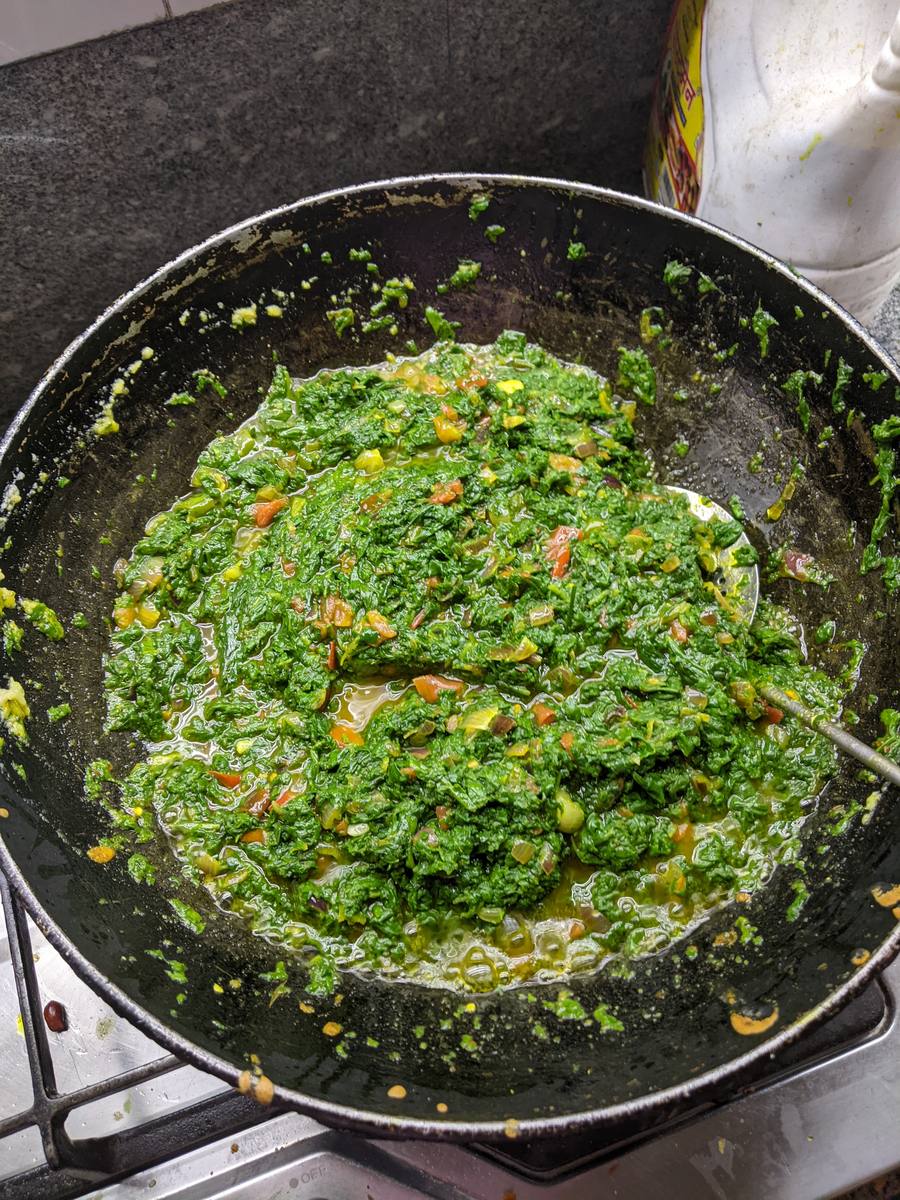 Saag cooking in the wok