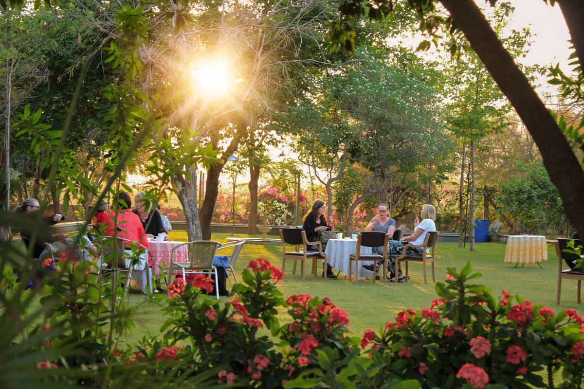 Outdoor dining in the farm garden at sunset