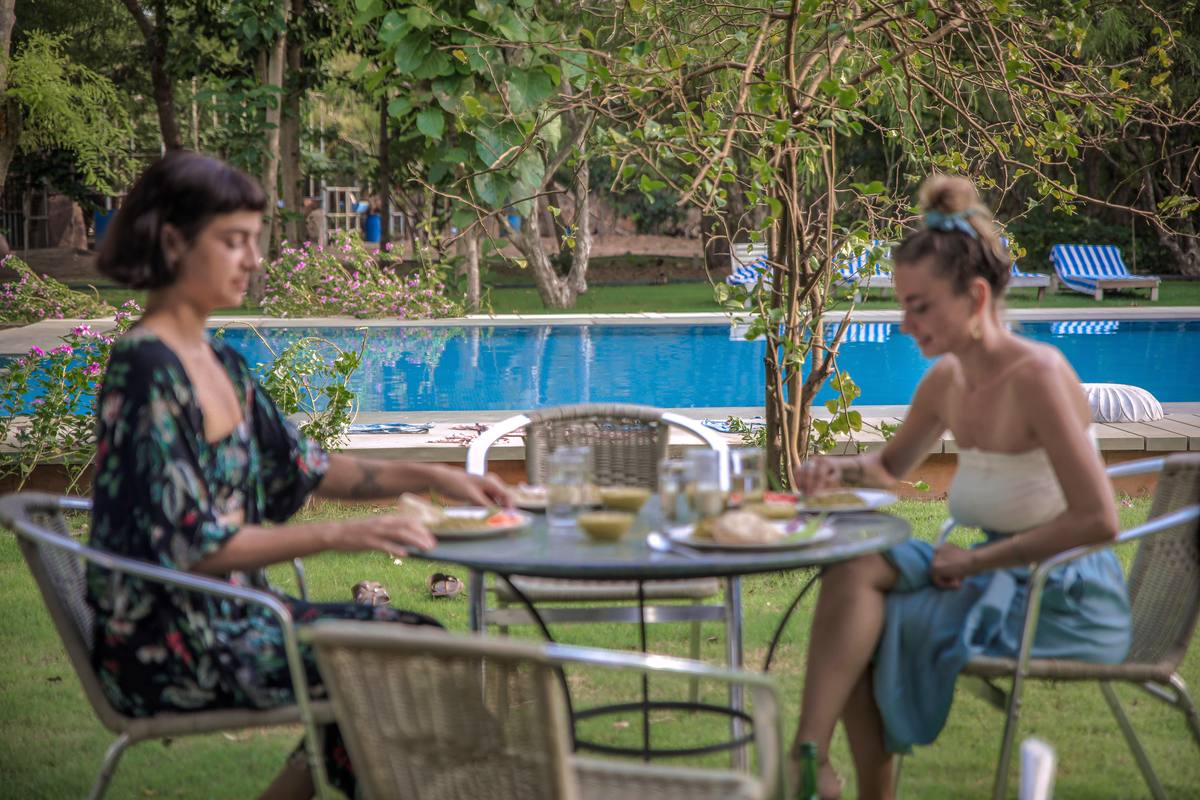 Guests dining by the pool