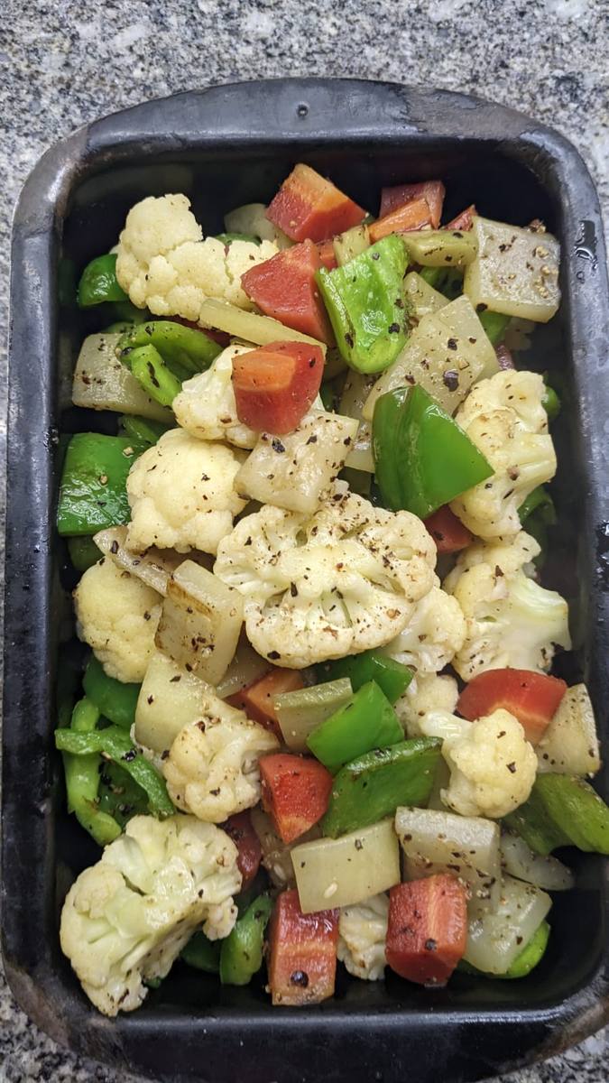Mixed vegetables on a black tray