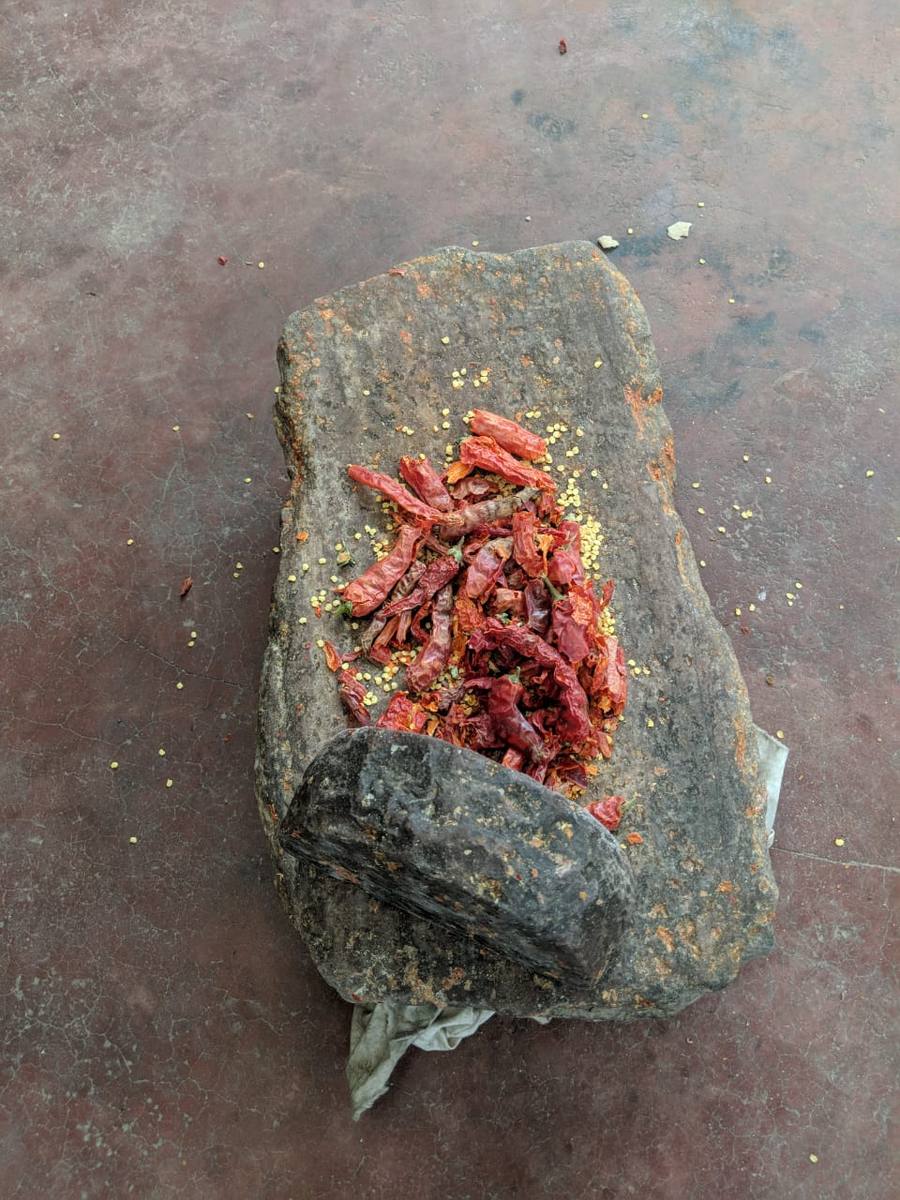 Red chillies ground on stone