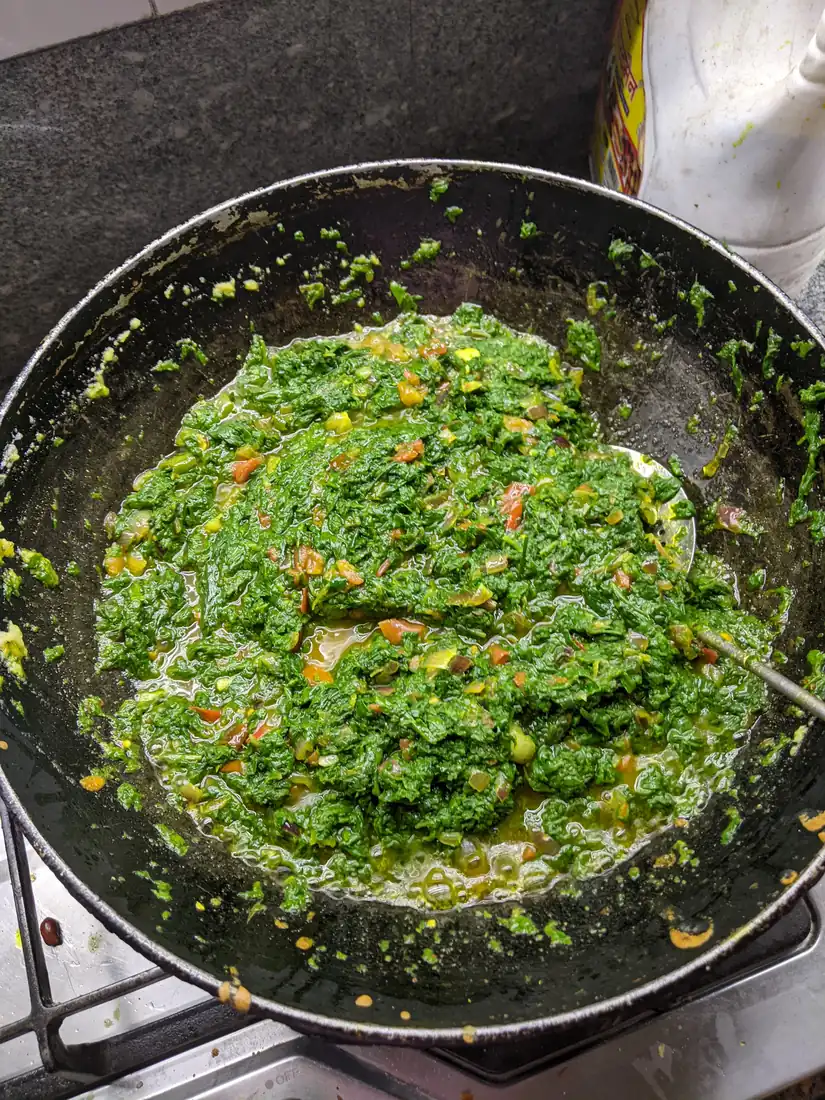 Saag cooking in the wok
