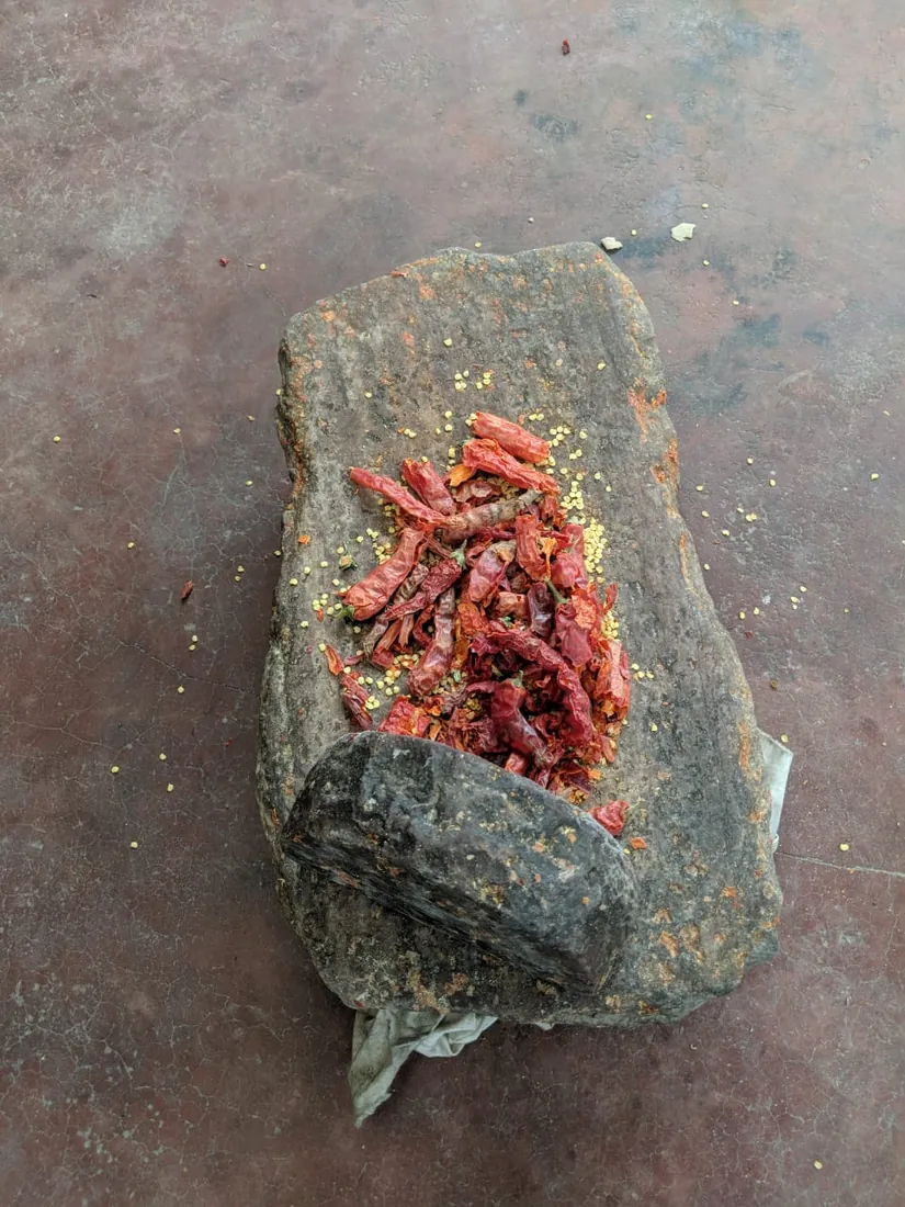Red chillies ground on stone