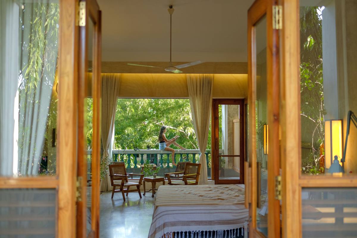 Through teak doors into the room