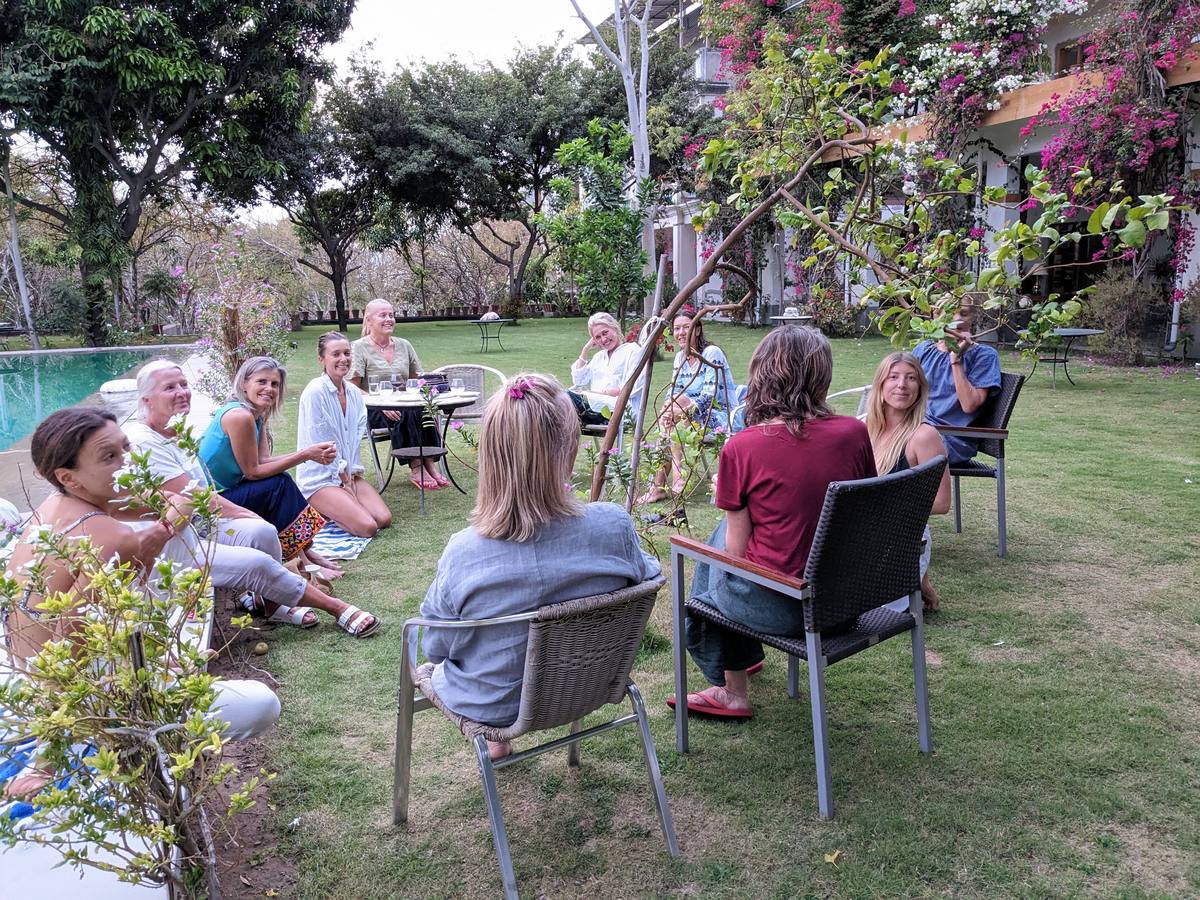Guests in the garden at PushkarOrganic — circle on lawn
