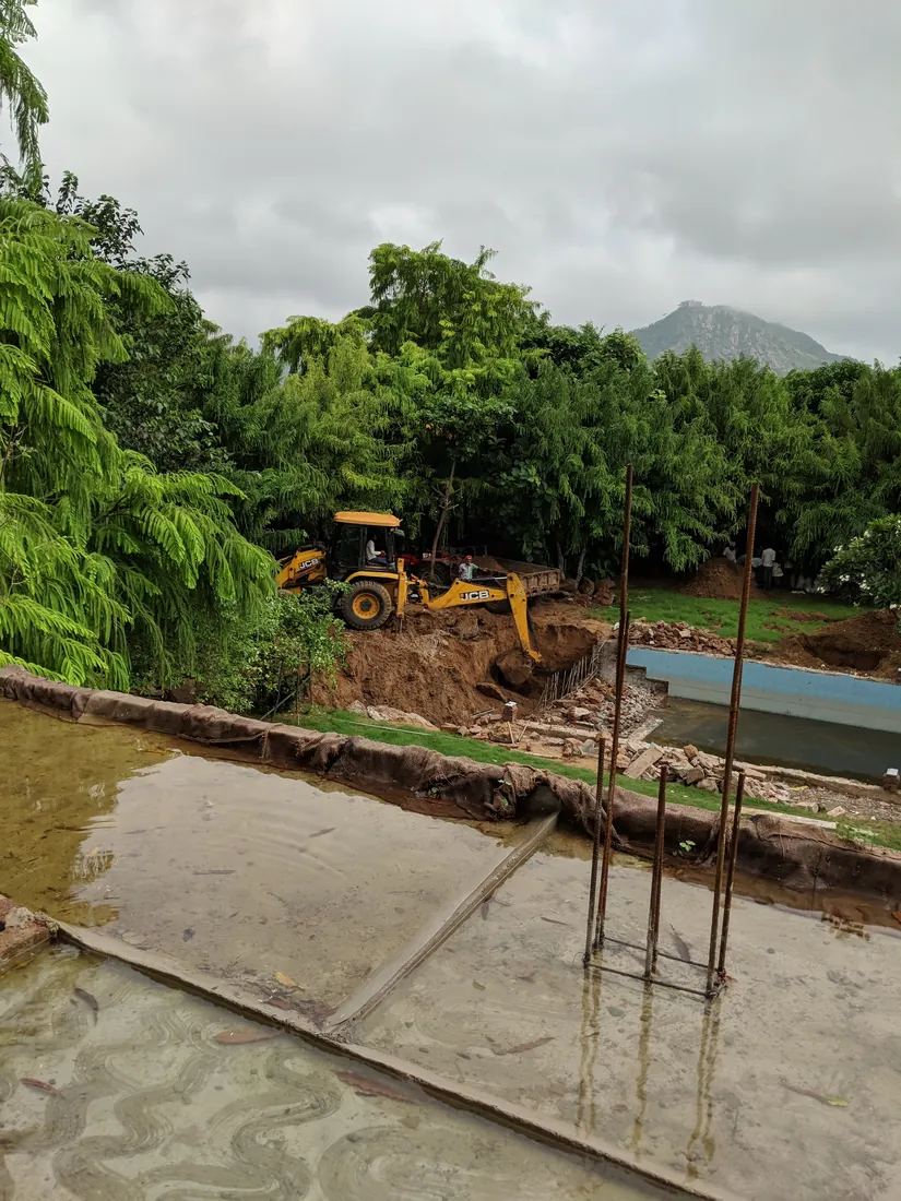 Excavating the pool site, with the Aravalli hills behind