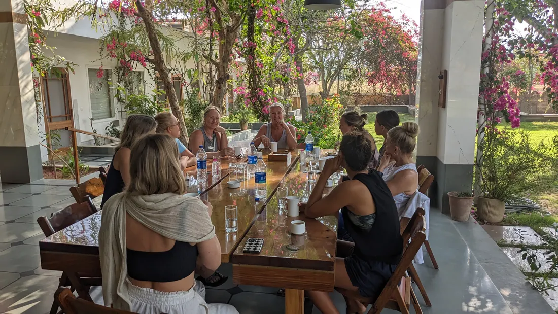 Guests at the long table for an outdoor lunch